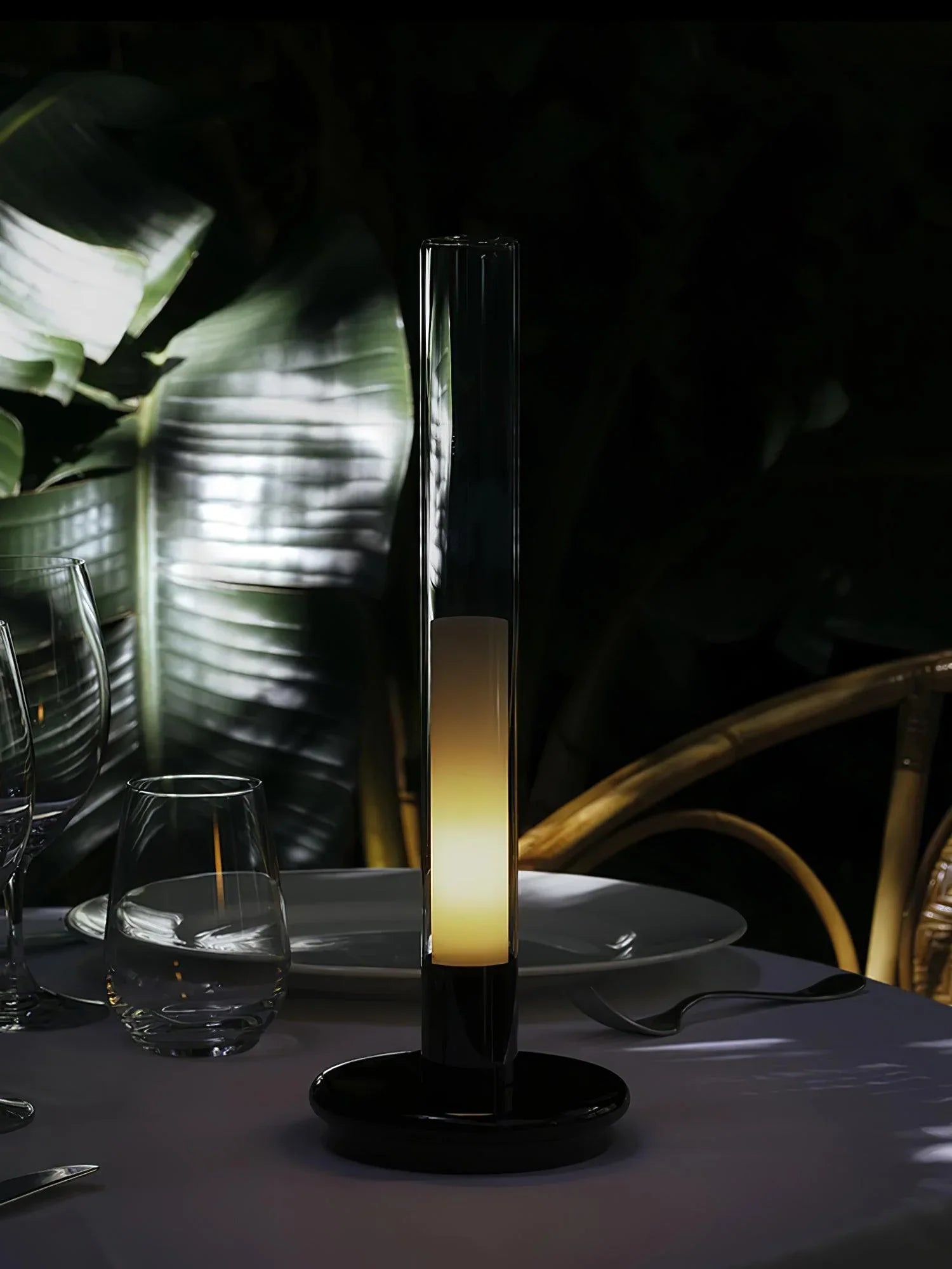 Modern black and white column table lamp with warm light on elegant dinner table, YH Lamps