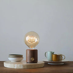 Modern YH Lamps walnut base table lamp with clear bulb, cozy dining setting in background