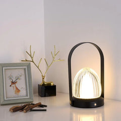 Modern black table lamp with touch switch and built-in battery on a corner table at YH Lamps