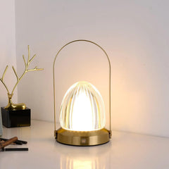 Modern gold table lamp with built-in battery and touch switch on a white surface, YH Lamps