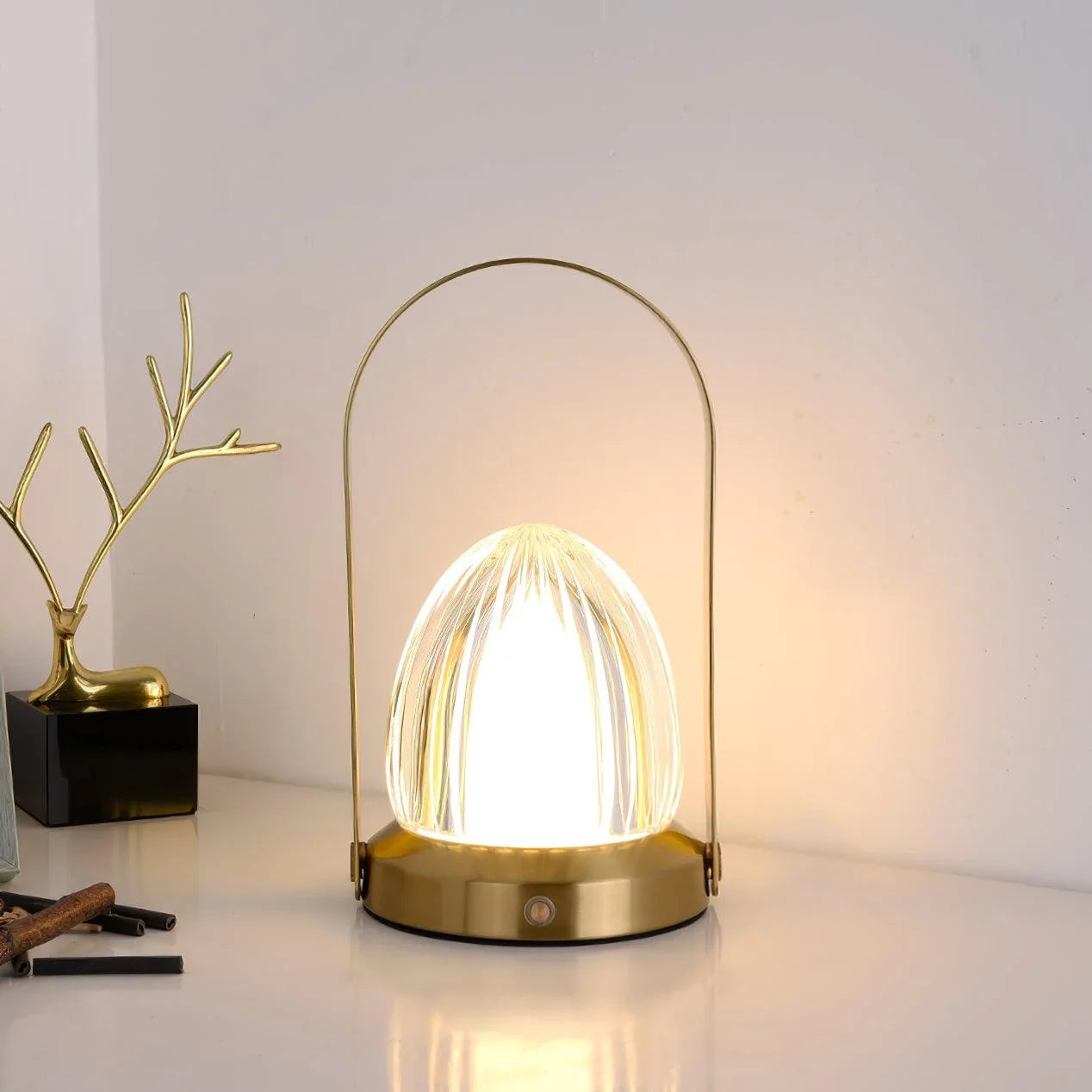 Modern gold table lamp with built-in battery and touch switch on white desk at YH Lamps