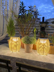 Yellow rattan USB table lamps on outdoor table with plants, modern home lighting by YH Lamps
