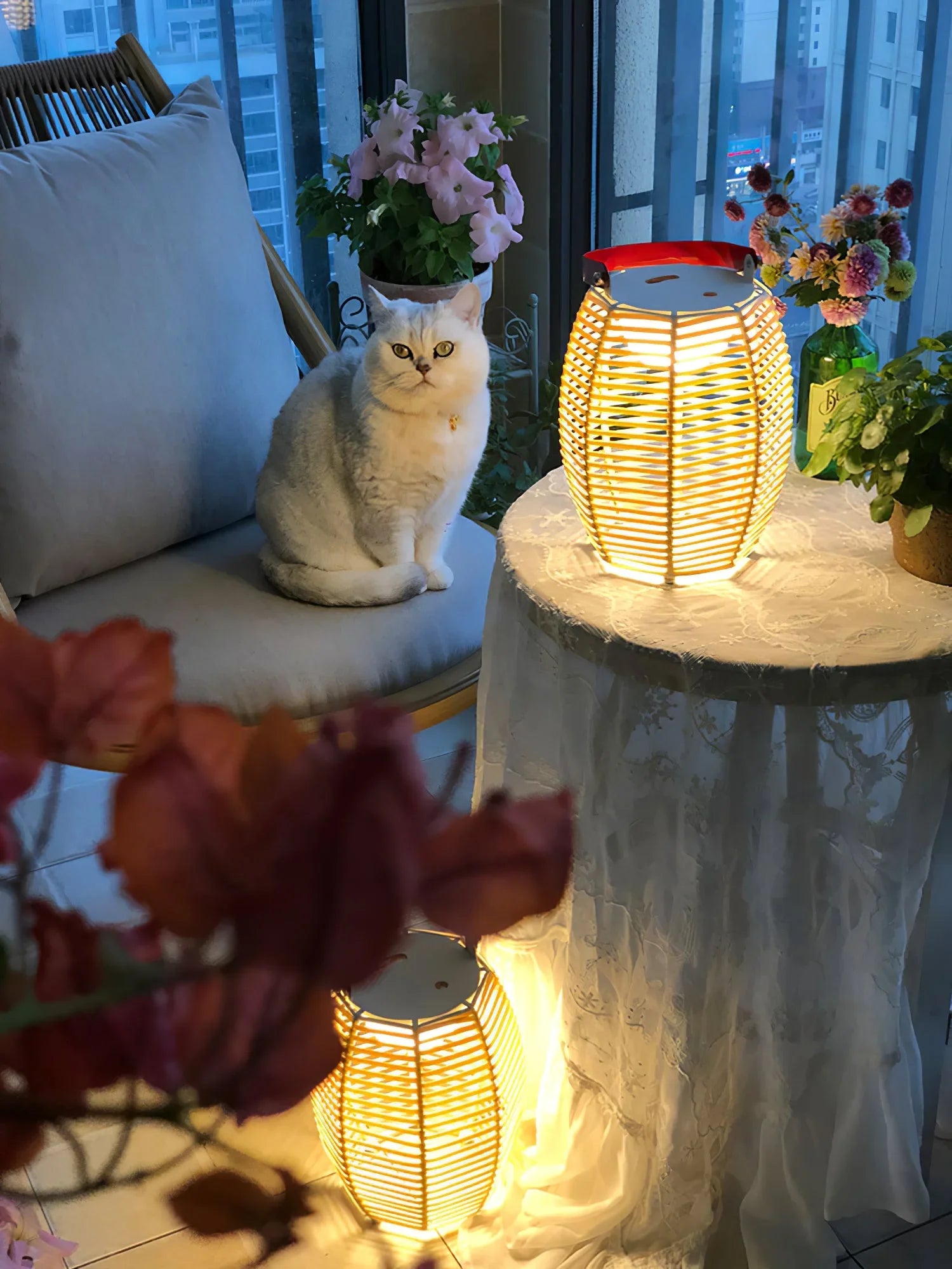 Modern yellow-white YH table lamp with built-in battery on lace table, cozy home scene with cat