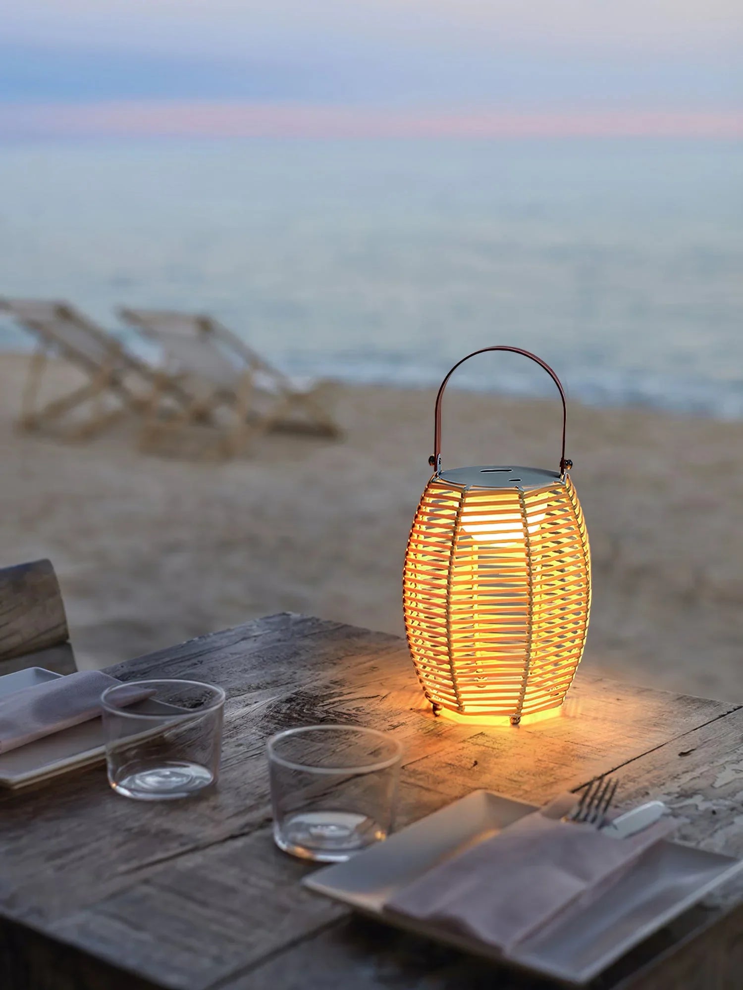 Yellow white USB table lantern with handle on rustic beachside table, modern YH Lamps design