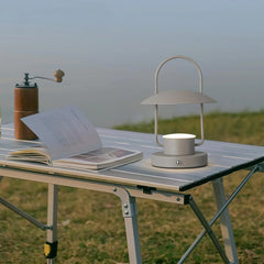 Modern dark gray touch switch table lamp on outdoor table with book and coffee grinder, YH Lamps