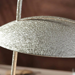 Textured metallic table lamp shade in close-up, modern lighting by YH Lamps