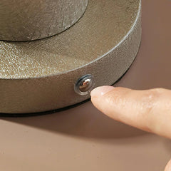 Finger touching touch switch on dark gray YH Lamps portable table lamp base