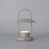 Modern dark gray portable table lamp with touch switch by YH Lamps, minimal design, lit on gray background