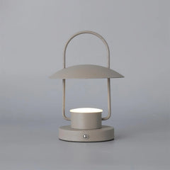 Modern dark gray portable table lamp with touch switch by YH Lamps, minimal design, lit on gray background