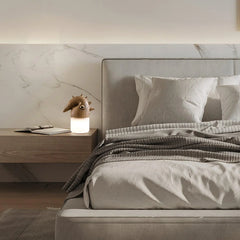 Modern bedroom with YH Lamps designer wood accent table lamp on nightstand, warm light