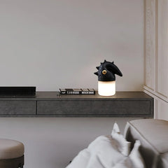Modern black and white table lamp with sculptural top on a minimalist desk, YH Lamps.