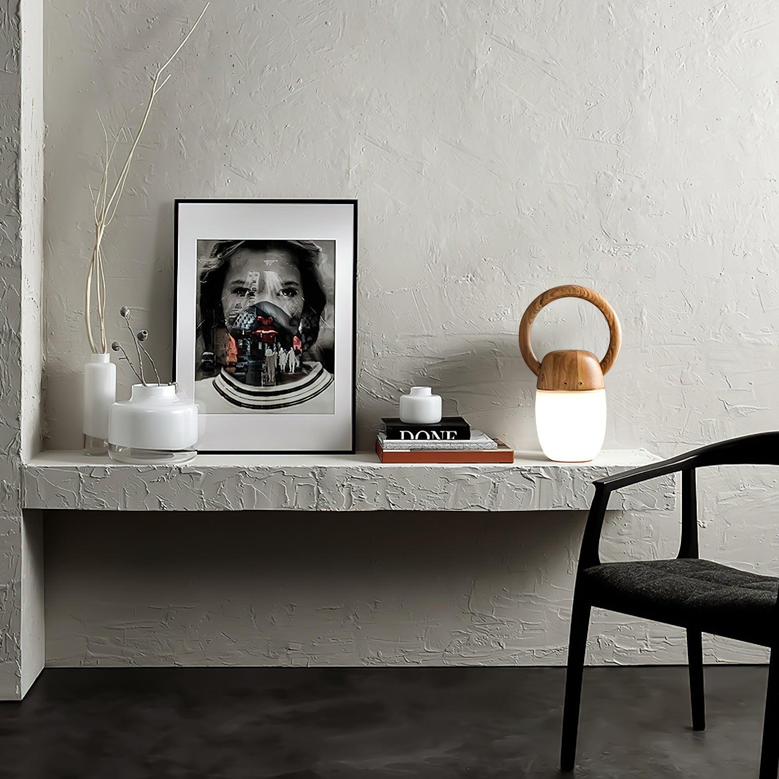 Modern wood handle table lamp with warm light on minimalist shelf, YH Lamps home lighting