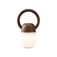 Modern wooden Zen Buddha table lamp with circular handle and warm light from YH Lamps