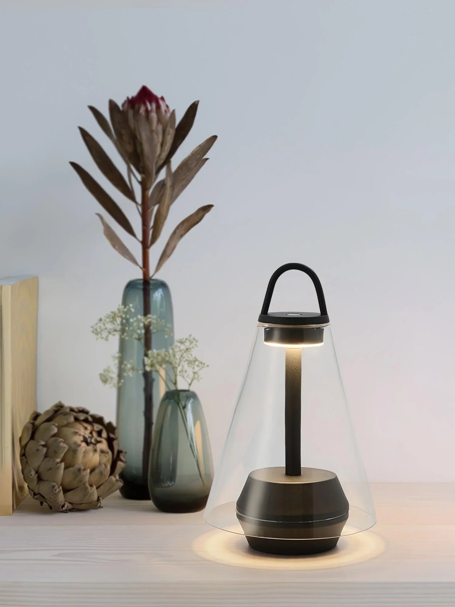 Modern black and clear table lamp with built-in battery on light wood desk, YH Lamps home décor