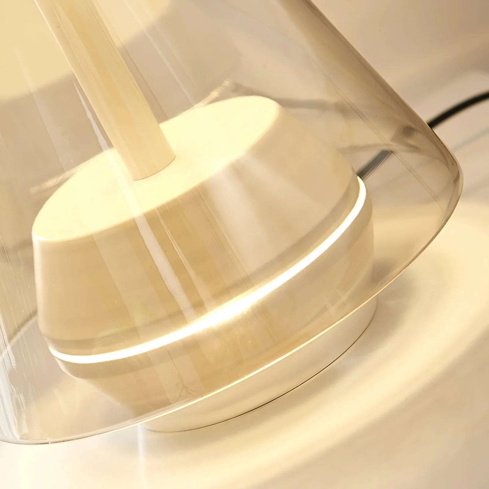 Modern table lamp with clear shade, warm LED light, and sleek design from YH Lamps