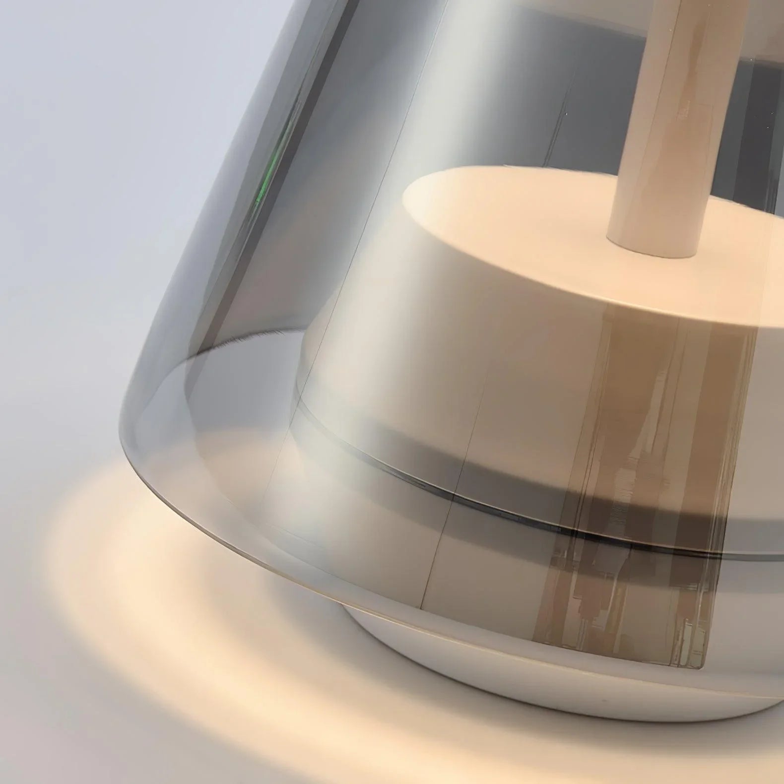 Modern black and clear table lamp with warm light from YH Lamps on white surface