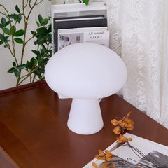 Modern white mushroom table lamp on wooden desk with books, for YH Lamps home lighting