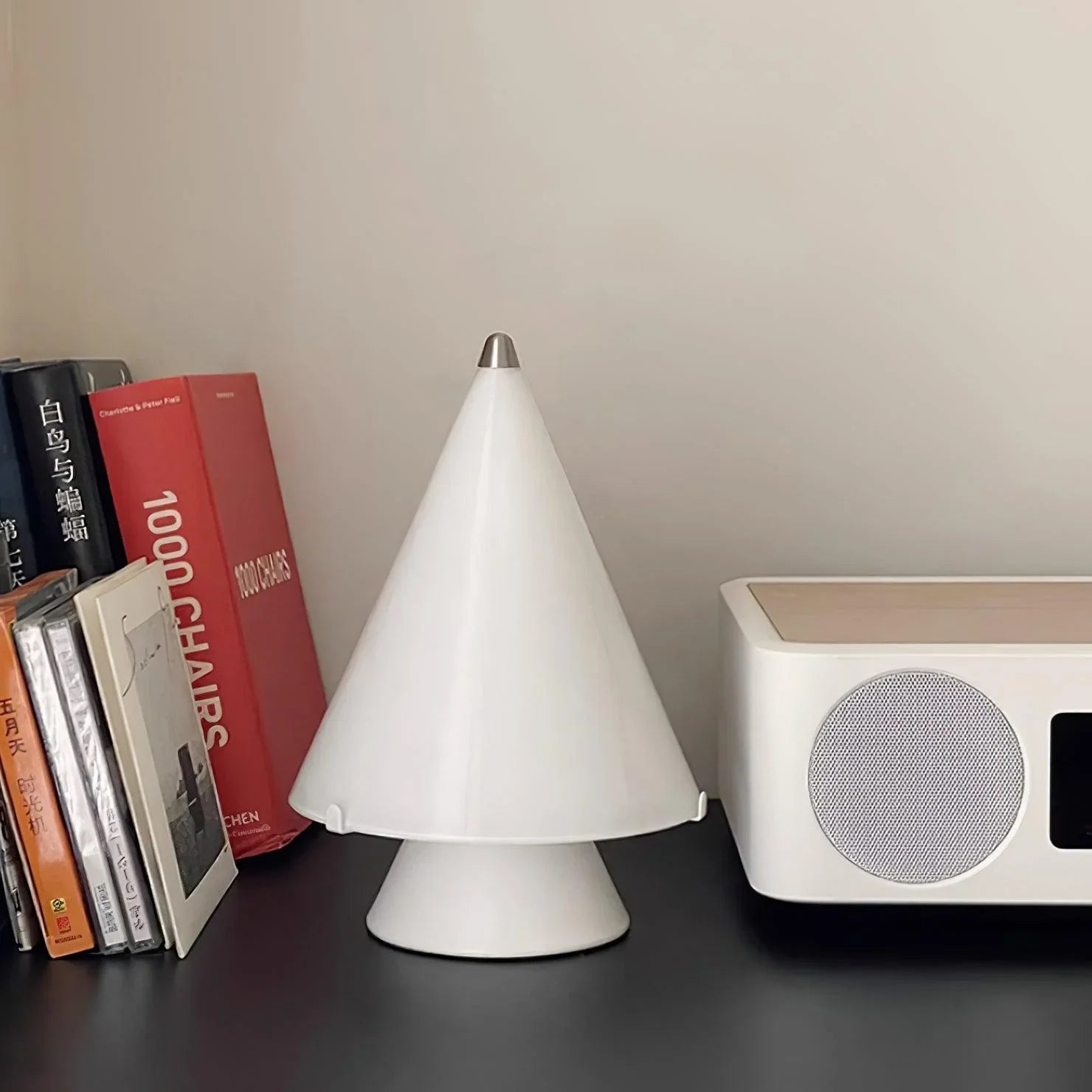 Modern white cone table lamp with touch switch on desk near books and speaker by YH Lamps