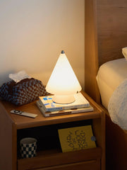 Modern white cone-shaped table lamp with touch switch on wood nightstand, YH Lamps home lighting