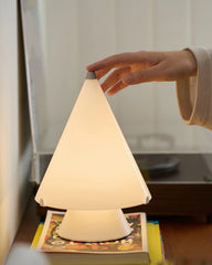 Modern white touch table lamp on books, hand activating lamp, YH Lamps home lighting