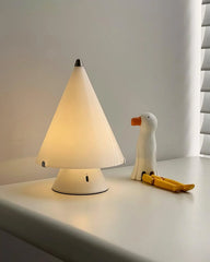 Modern white table lamp with touch switch on bedside table, next to duck figurine, YH Lamps
