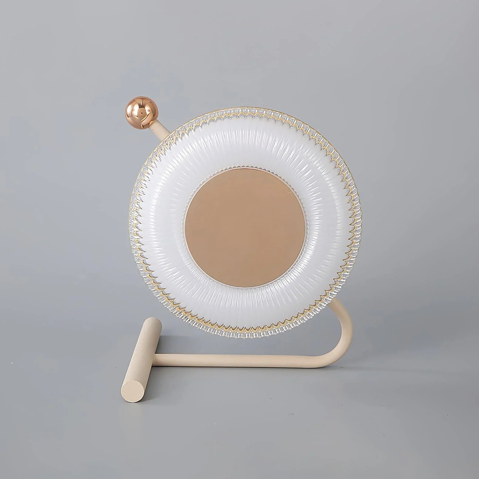 Modern table lamp with round pink and gold design on neutral background from YH Lamps