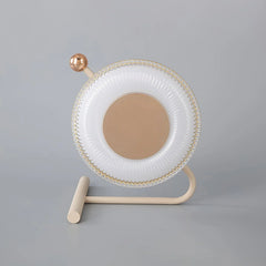 Modern table lamp with round pink and gold design on neutral background from YH Lamps