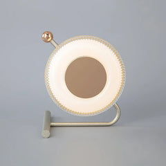 Modern circular table lamp with gold and pink accents on gray background, YH Lamps