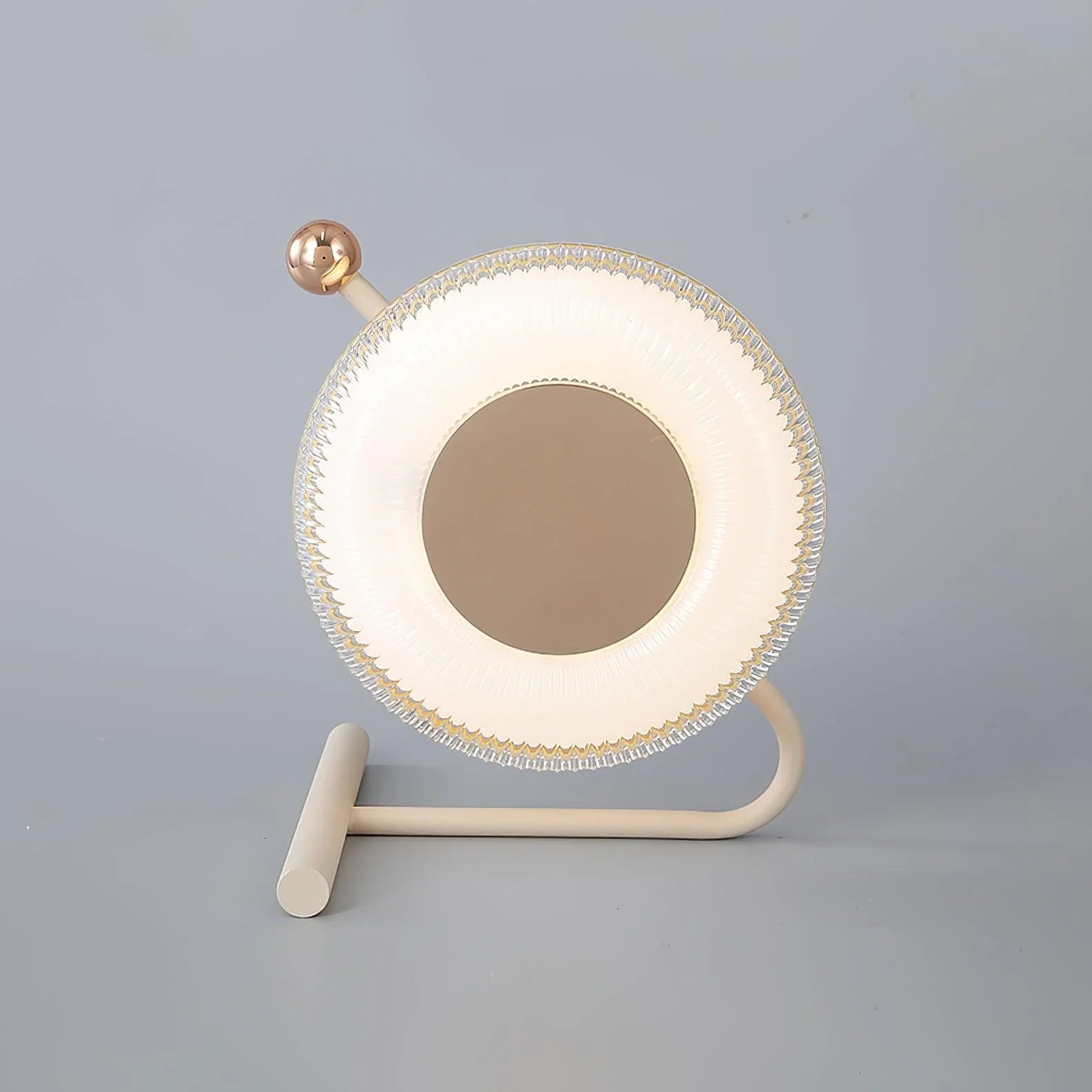 Modern circular table lamp with soft LED light and gold accent on gray surface, YH Lamps
