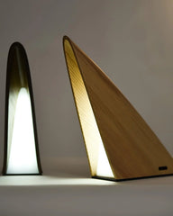 Modern wood triangular table lamps with warm LED light from YH Lamps on neutral background