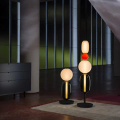 Modern YH Lamps table lamps with black bases and warm light globes in contemporary room with large windows