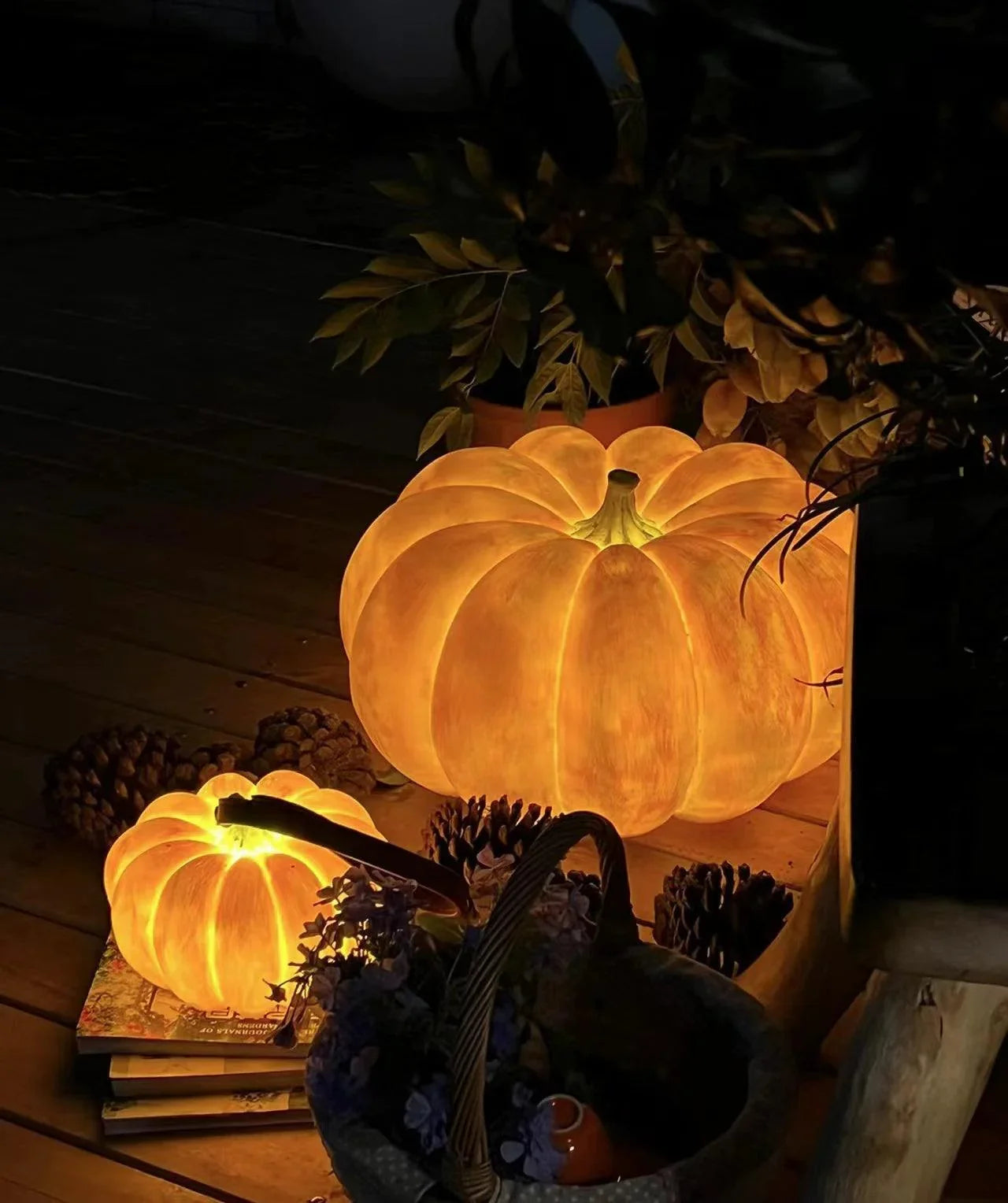 Warm yellow pumpkin-shaped table lamp with built-in battery, USB portable, on wooden floor