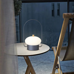 Modern dark red touch switch table lamp with soft white glow on a round table, YH Lamps