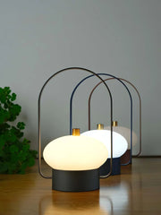 Modern YH Lamps table lamps with soft white glow and dark red base on wooden surface