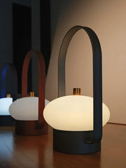 Modern dark red portable table lamp with touch switch and oval soft light on wood surface