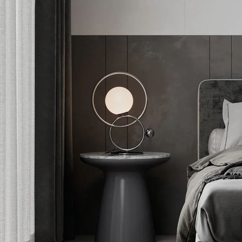 Modern double ring designer table lamp with frosted globe light on bedside table, YH Lamps