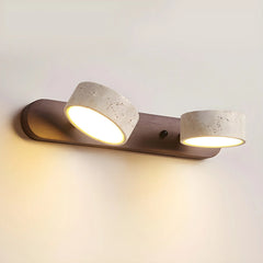 Modern 2-light walnut wall lamp with travertine round shades emitting warm light