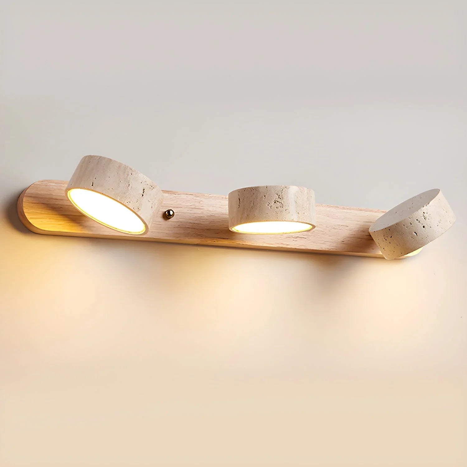 Modern 3-light wall lamp with walnut wood base and warm travertine shades illuminating wall