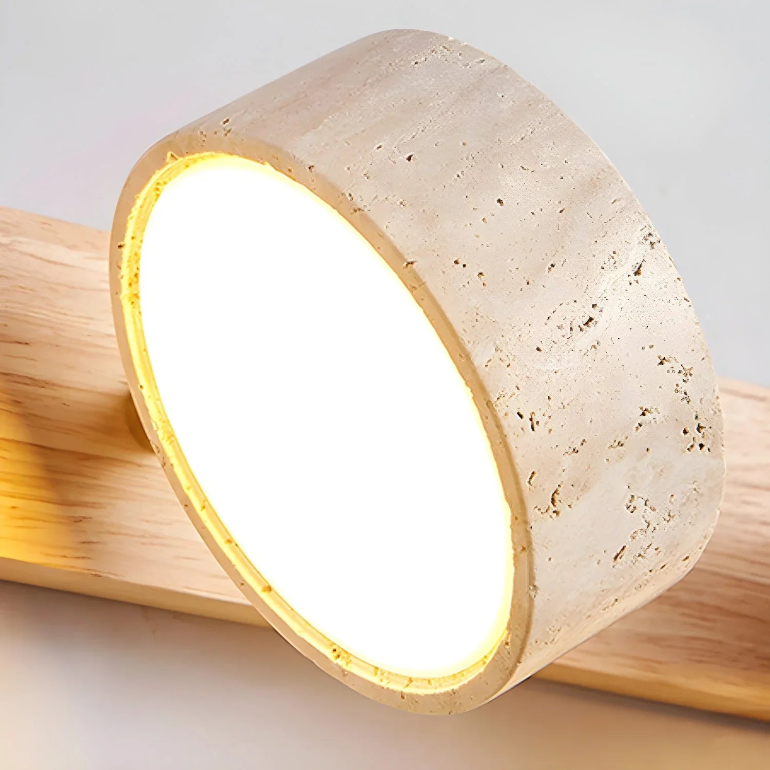 Modern travertine round wall lamp with warm white light and walnut wood mount