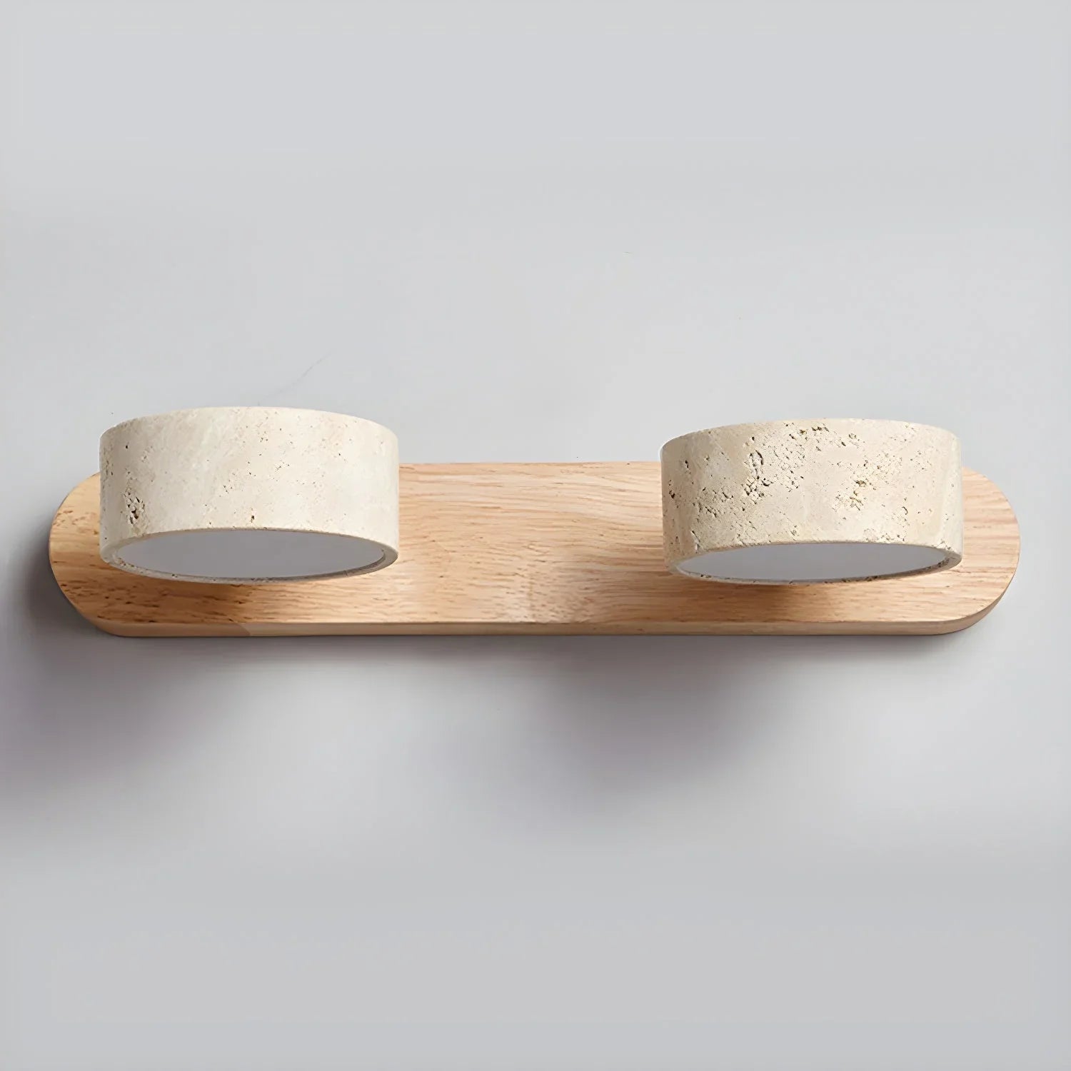 Modern 2-light wall lamp with walnut base and travertine round shades, warm ambient lighting
