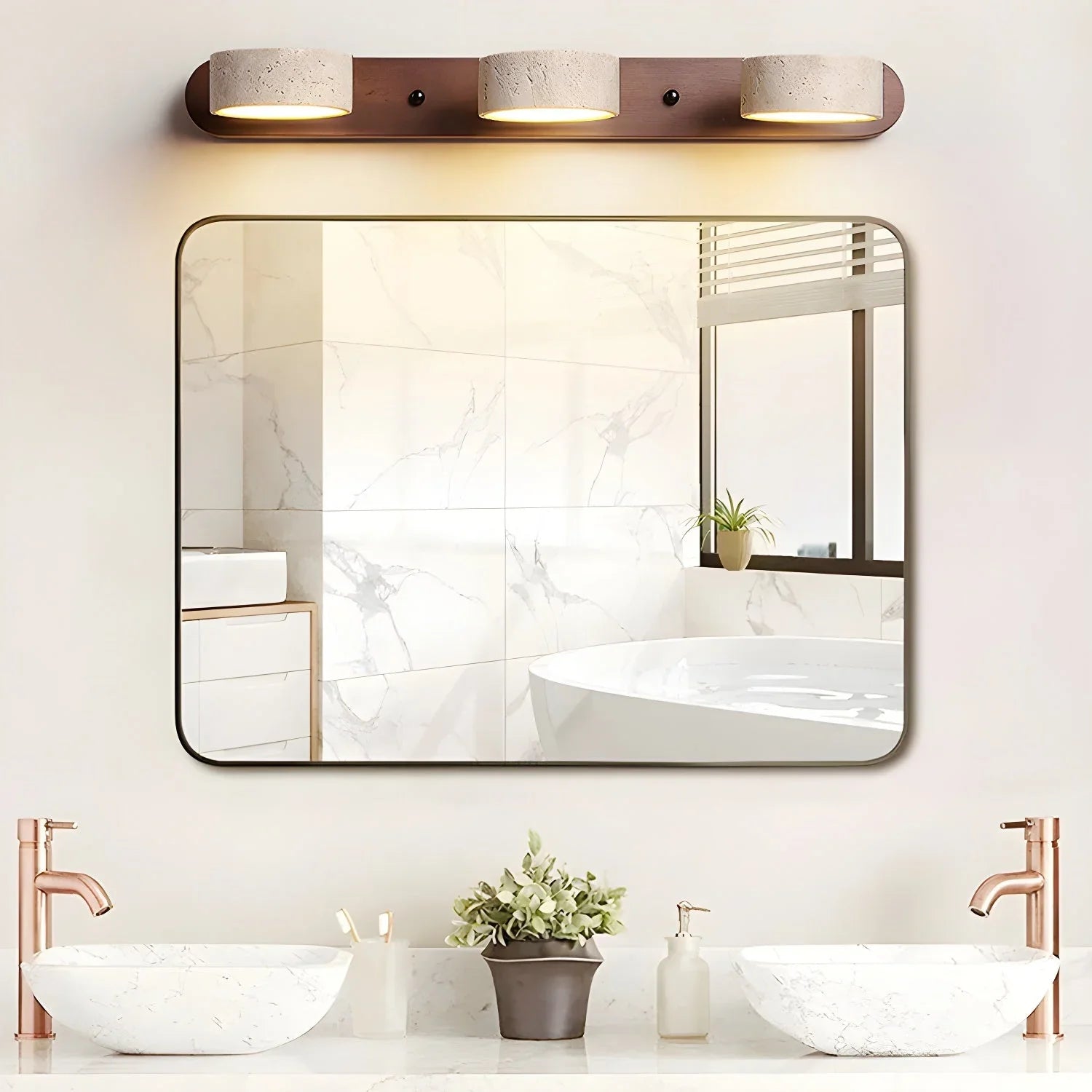 Modern walnut color wall lamp with three travertine light shades above bathroom mirror with double marble sinks