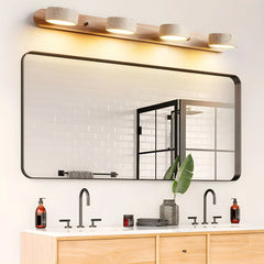 Modern walnut color 4-light wall lamp over large bathroom mirror with black frame and double sink vanity