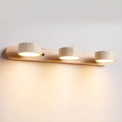 Modern 3-light wall lamp with warm travertine shades on walnut base illuminating a white wall