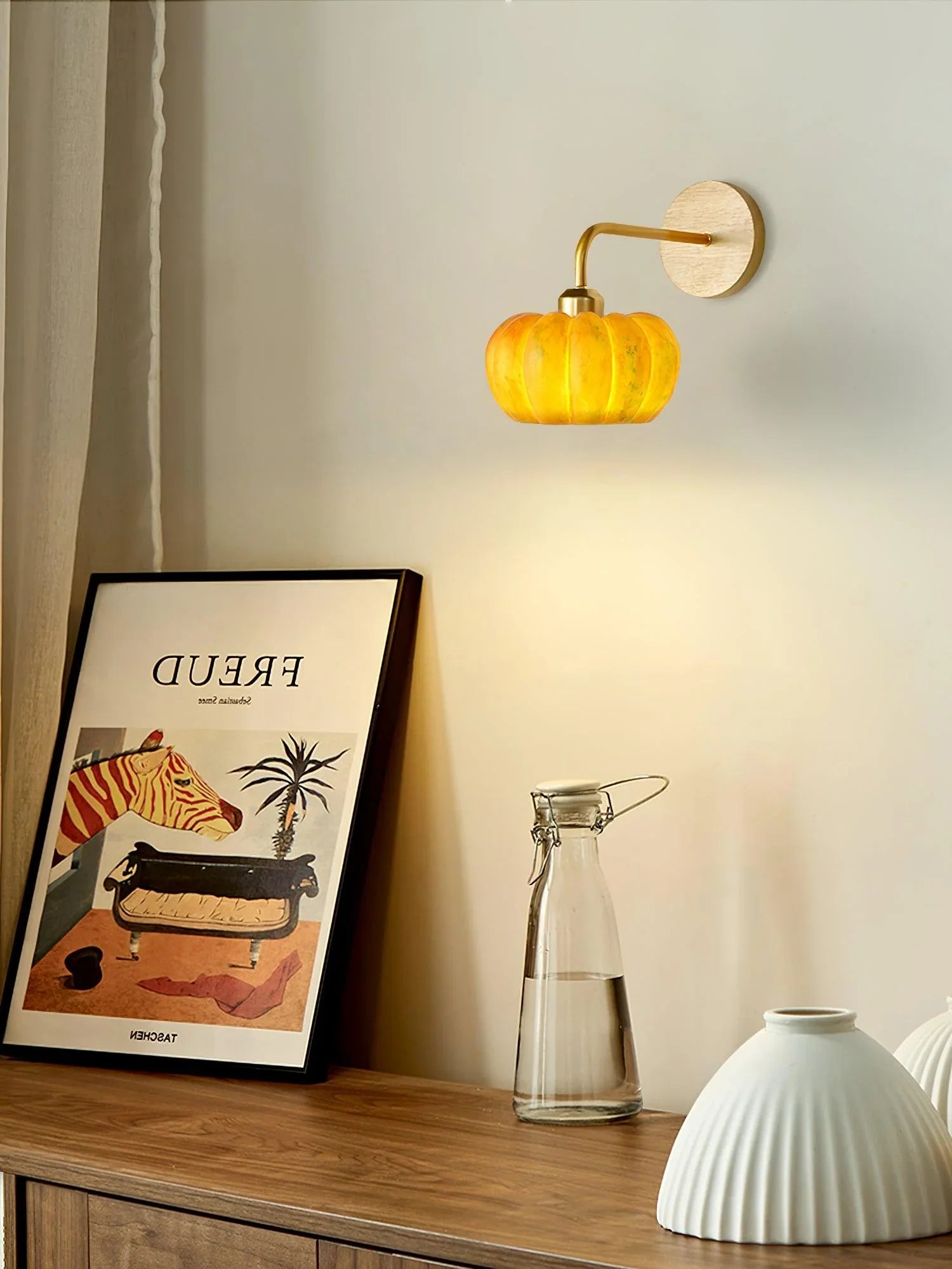 Yellow gold pumpkin-shaped wall lamp, modern home lighting by YH Lamps, mounted above decor