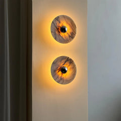 Modern marble wall sconces with warm LED light on a gray wall at YH Lamps