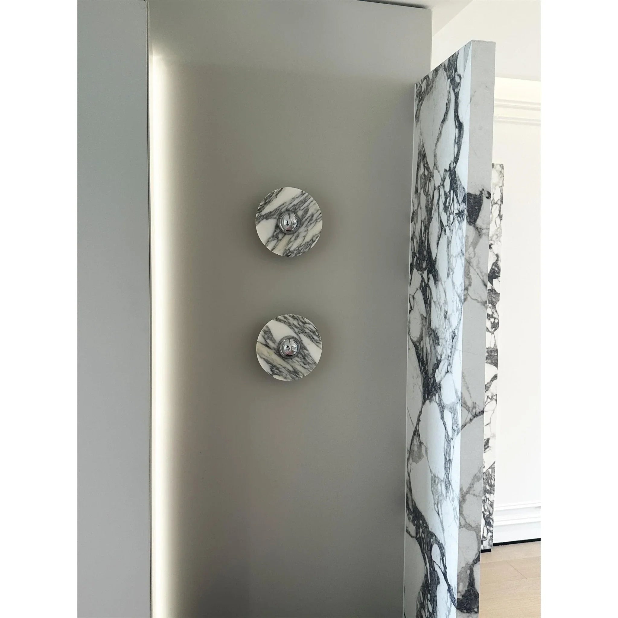Modern marble wall lamps with chrome accents on a neutral wall, YH Lamps elegant lighting