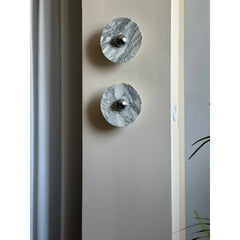 Modern marble wall lamps with chrome accents mounted on a beige wall, YH Lamps lighting