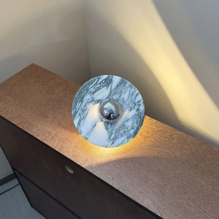 Modern marble and chrome wall lamp with warm light on wooden cabinet, YH Lamps home lighting