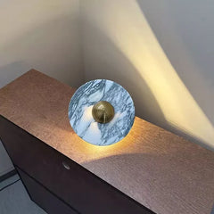 Modern marble wall lamp with brass accent on wood cabinet, warm light, YH Lamps