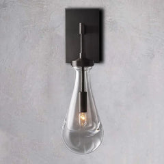 Modern raindrop glass wall sconce with black mount from YH Lamps on light gray wall
